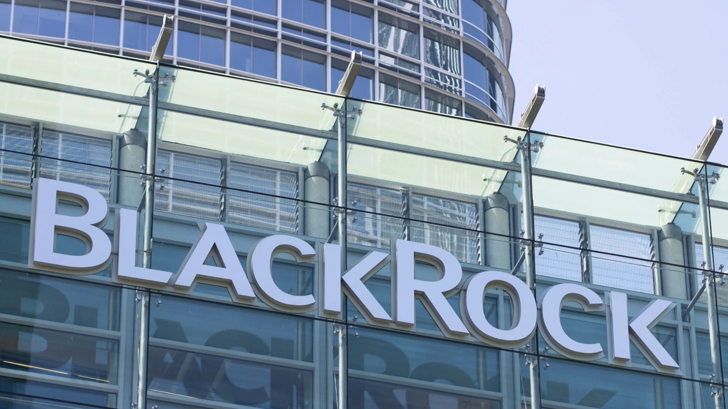 BlackRock company logo displayed on the exterior of a modern office building