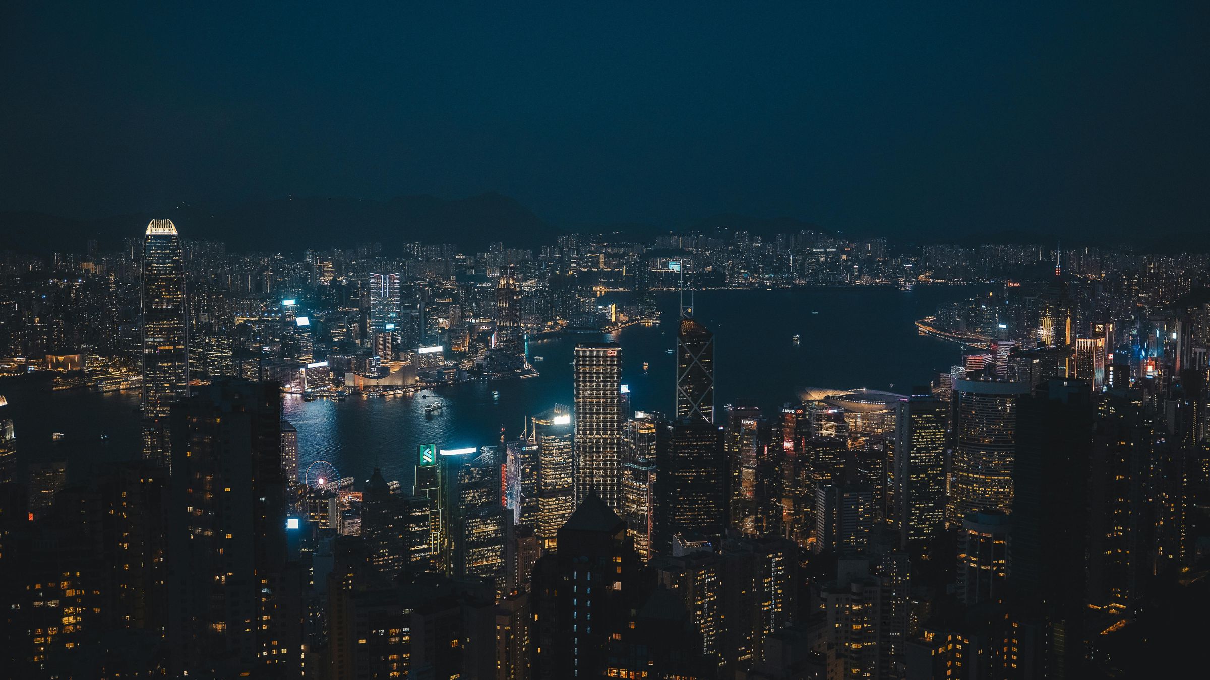 Night skyline of Hong Kong’s financial district overlooking Victoria Harbour, representing the city’s first stablecoin licensing approvals.