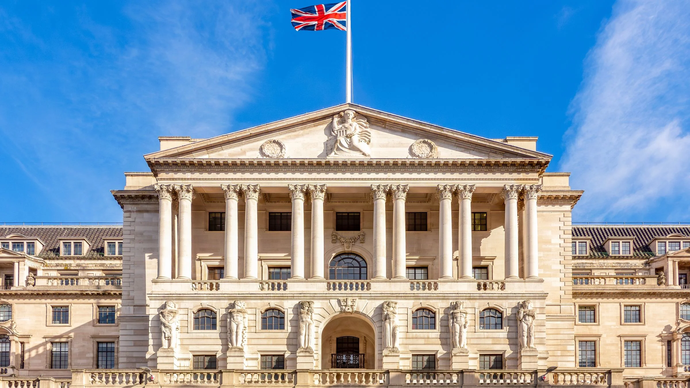Historic Bank of England building with Union Jack flag in London