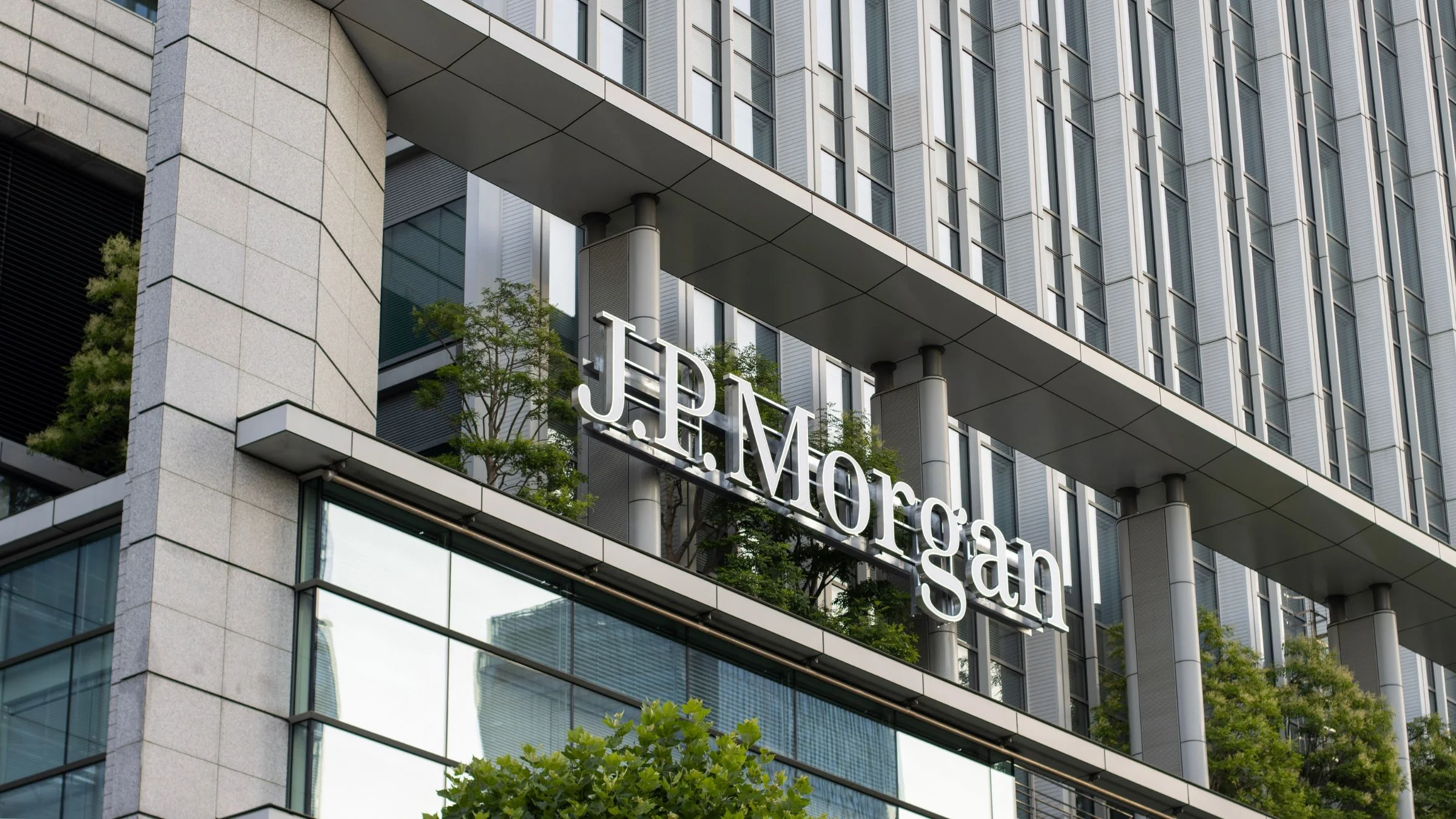 JPMorgan company logo displayed on a modern office building exterior