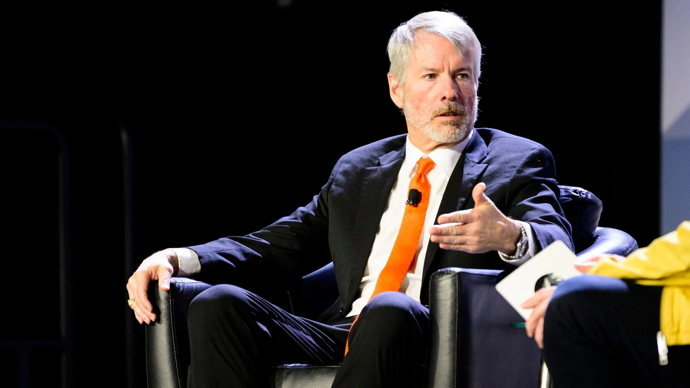 Michael Saylor speaking during a panel discussion at a finance and technology conference