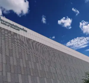 Exterior of the Bank of Thailand headquarters under a blue sky