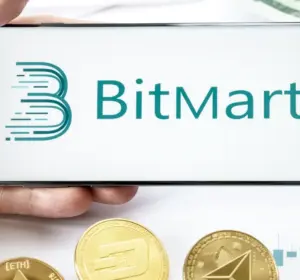 Hand holding a smartphone displaying the BitMart logo beside cryptocurrency coins, market charts, and US dollar notes.