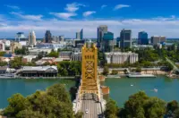 Aerial view of Sacramento with Tower Bridge spanning the river and downtown buildings in the background