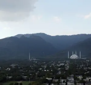Wide view of Islamabad with the Faisal Mosque beneath the Margalla Hills
