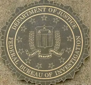 FBI seal mounted on a granite building wall