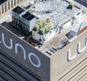 Aerial view of a high-rise building displaying the Luno logo on its exterior