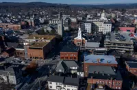 Aerial view of a New Hampshire downtown district with churches, offices and residential buildings