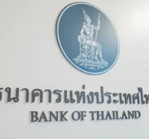 Bank of Thailand emblem and bilingual name displayed on a white interior wall
