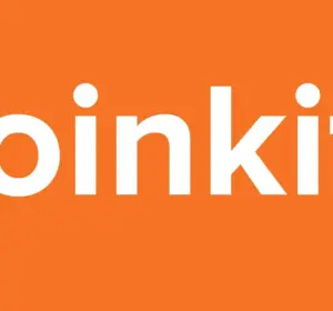White Coinkite company name displayed on a bright orange background Image