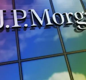 J.P. Morgan sign mounted on a colorful glass office building facade