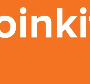 White Coinkite company name displayed on a bright orange background Image