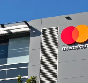 Mastercard logo displayed on the exterior of a modern office building