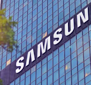 Samsung name displayed across the glass facade of a modern corporate office building in daylight.